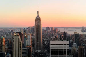 Outlet De Skyline van New York bij zonsondergang fotobehang Architectuur