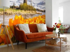 Online Hollandse molen met oranje tulpen op de voorgrond fotobehang Steden | Architectuur