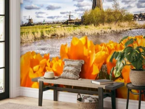 Online Hollandse molen met oranje tulpen op de voorgrond fotobehang Steden | Architectuur
