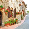 Online Italiaans straatje met veel bloemen fotobehang Architectuur