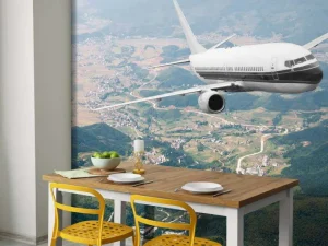 Hot Passagiersvliegtuig boven een berglandschap fotobehang Transport