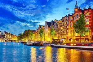 Best Rivier de Amstel in de avond fotobehang Steden | Architectuur