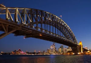 Clearance Sydney Harbour Bridge in de avond fotobehang Architectuur
