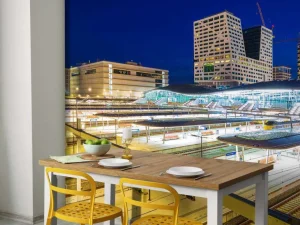 Online Utrecht Centraal Station in de avond fotobehang Architectuur